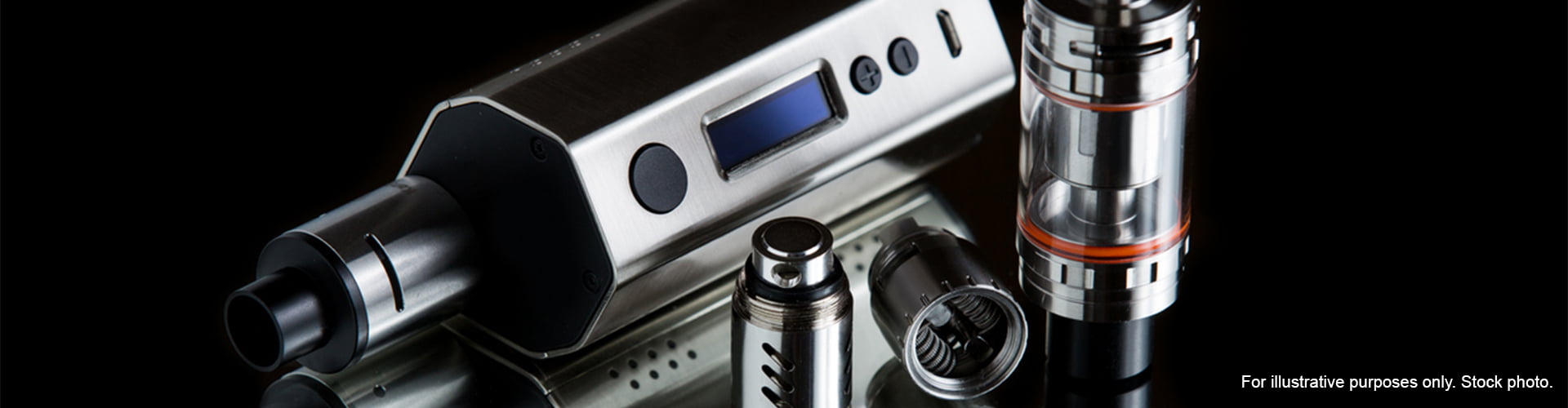 Vape next to tank and components